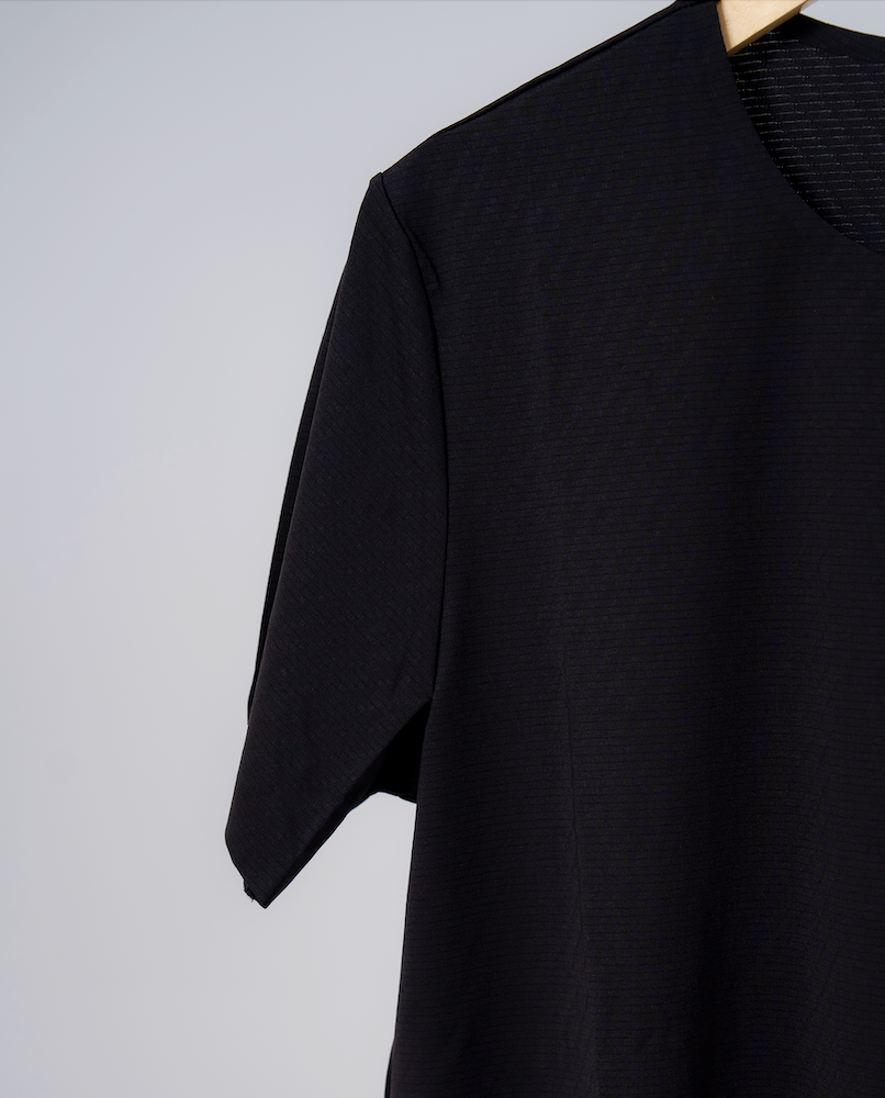 A close-up of the gennady a high performance t-shirt made out of lightweight fabric designed for training, travel and performance.