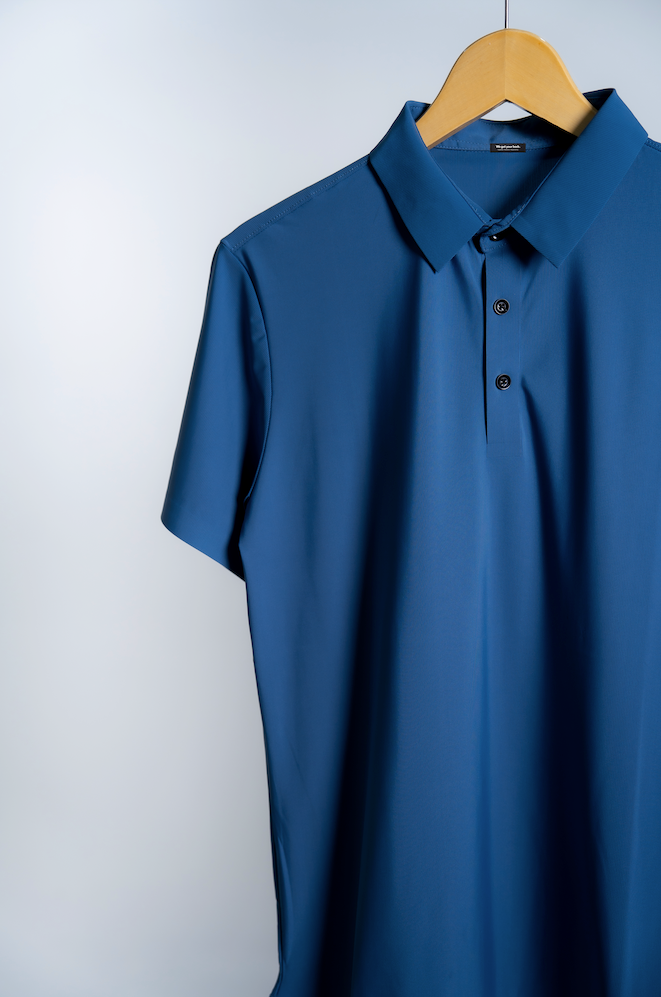 the Vitali a short-sleeve blue mens polo shirt made out of high performance fabric designed for active lifestyle, travel and everyday comfort.